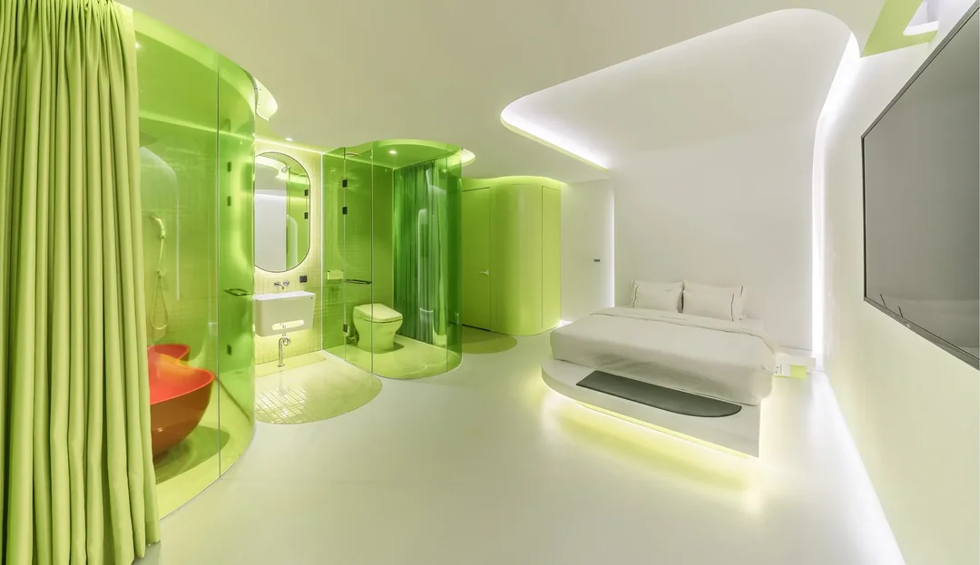 Modern hotel suite featuring translucent furniture, soft lighting, and organic flowing forms that embody Frutiger Aero principles in physical space design